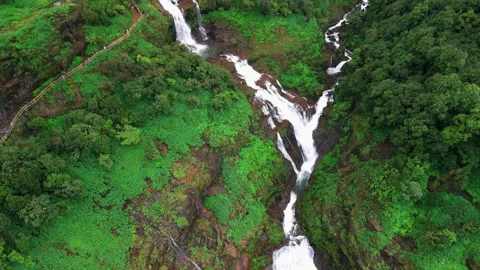 Aerial View of a Double Waterfall Cascading Through the Lush Green Mountains Stock Footage 342701859