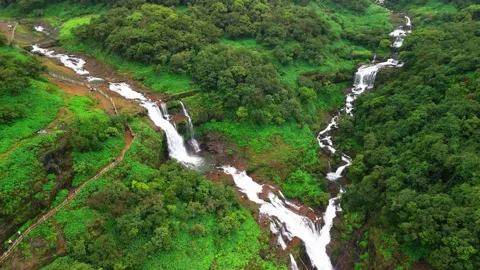 Aerial View of a Double Waterfall Cascading Through the Lush Green Mountains Stock-Footage 342701862