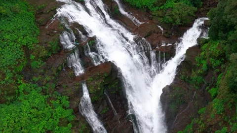 Aerial View of a Double Waterfall Cascading Through the Lush Green Mountains Stock-Footage 342701904