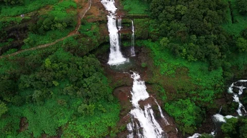 Aerial View of a Double Waterfall Cascading Through the Lush Green Mountains Stock-Footage 342701924
