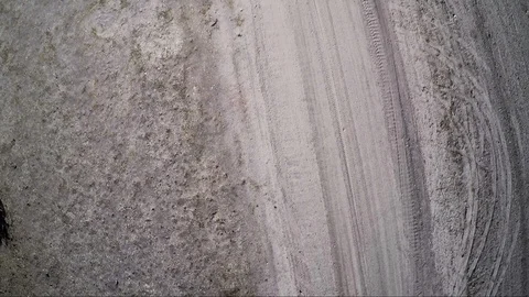 Aerial view down on a biker on a former desert race track course Stock Footage 92108290