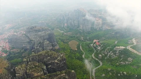 Aerial view down to dramatic Meteora monasteries Stock Footage 137630134