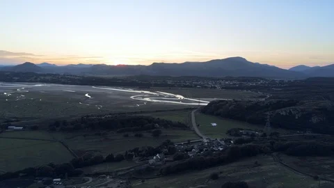 Aerial view, down move. Drone panorama sunset over Dwyryd river, hills in bac Video stock 94249276