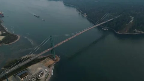 Aerial view down over Vancouver's Lions Gate bridge 動画素材 248484000