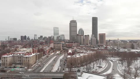 Aerial View of Downtown Boston in the winter with snow on the ground Stock Footage
