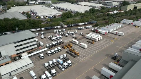 Aerial view of a DPD logistics yard with a railway train 動画素材 229764885
