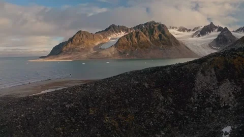 Aerial view of a dramatic arctic landscape featuring rugged mountain peaks Stock Footage 340076790