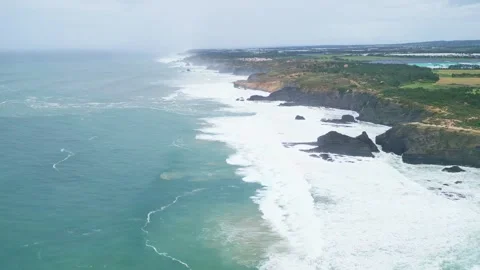 Aerial view of dramatic Atlantic coastline cliffs and crashing waves in Stock Footage 309112205