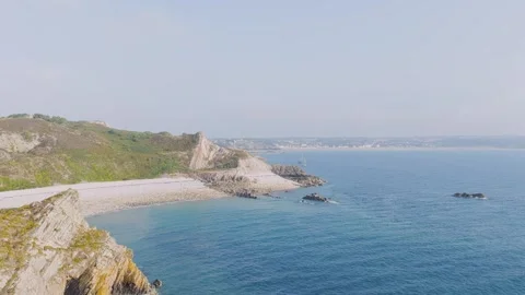 Aerial view of the dramatic cliffs and rocky coastline of Cap dErquy in Brittany Stock Footage 346665616