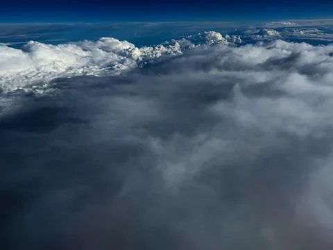Aerial view of dramatic clouds and deep blue sky above Paris, France captur.. Stock Photos