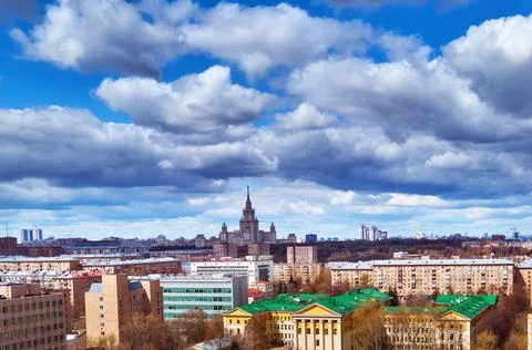 Aerial view of dramatic cloudy sky over Moscow and university skyscraper near Stock Photos