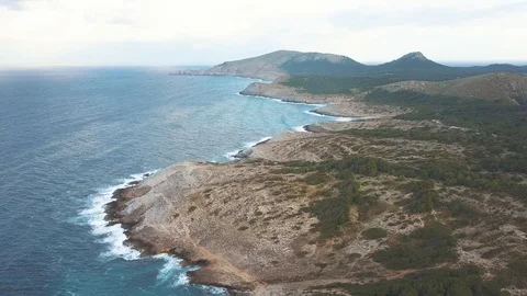 Aerial view of dramatic coastline with waves and rocks 스톡 동영상 101563810