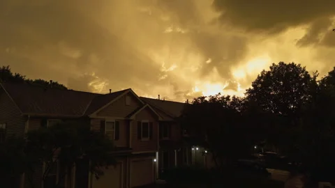 Aerial view of Dramatic golden storm clouds illuminated by the setting sun Stock Footage 340382909