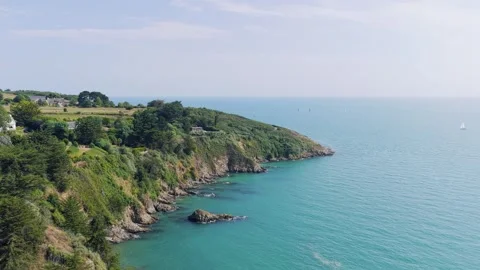 Aerial view of the dramatic green cliffs and rocky coastline of Binic, Brittany Stock Footage 346664897
