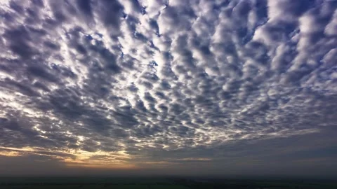 Aerial view of dramatic mackerel sky over rural landscape at sunrise Stock Footage 342924344