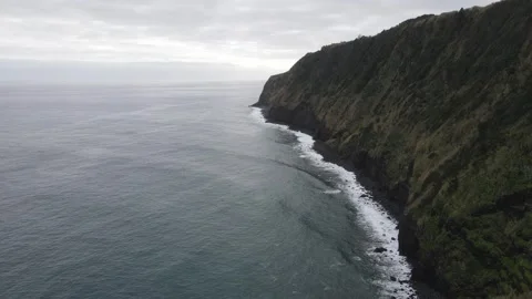 Aerial view of dramatic ocean cliffs and waves, Sao Miguel, Azores, 4K 60fps. Stock Footage 333377493