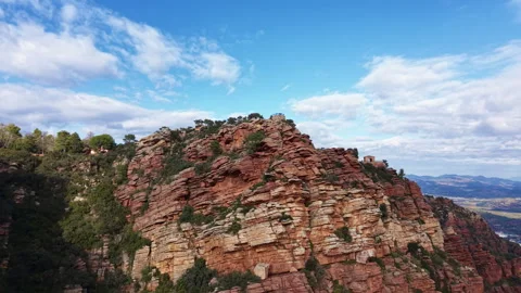 Aerial view of dramatic red sandstone cliffs at the Mirador de Garbi Video stock 326001274