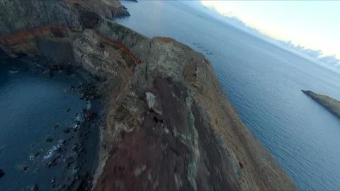Aerial view of the dramatic rocky cliffs and ocean of Ponta São Lourenço in Stock Footage 311510455