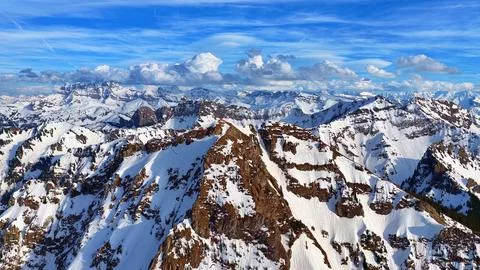Aerial view dramatic snowy mountain peaks and ridges Stock Photos