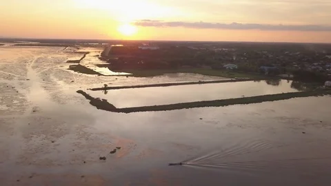 Aerial view of dramatic summer sunset over Nong Han lake, Sakon Nakhon, Thailand Stock Footage 90680043