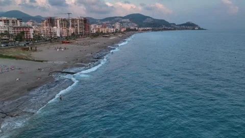 Aerial View: A dramatic sunset fills the Mediterranean sky with warm, glowing Stock Footage 296032288