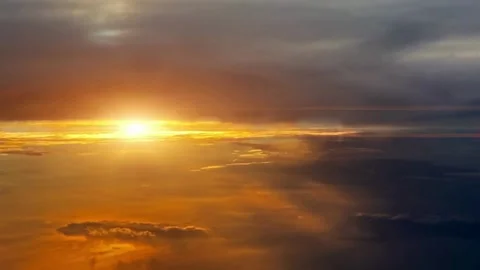 Aerial View of a Dramatic Sunset with Golden Hues and Cloud Formations Stock-Footage 310324362