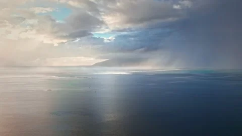 Aerial view of dramatic sunset rain, sunrays, clouds in Pacific ocean, Polynesia Stock Footage 167210465