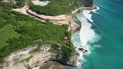 Aerial View of Dramatic Uluwatu Cliffs and Turquoise Ocean, Bali Stock Footage 328008838