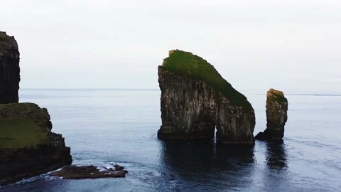 Aerial view of Drangarnir, a sea stack at Vagar in the Faroe Islands. Video stock 154555003