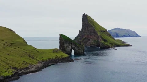 Aerial view of Drangarnir, a sea stack in the Faroe Islands. Video stock 154555181