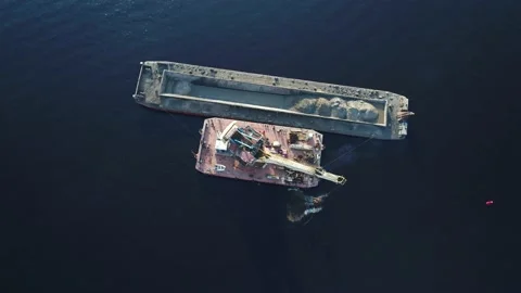 Aerial view. The dredger is working. Extraction of river sand by floating crane. Stock Footage 231059157