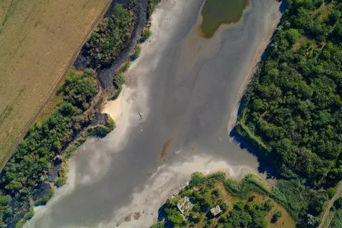 Aerial View of Dried-up Riverbed or Reservoir. Severe Drought and Climate Change Stock Photos