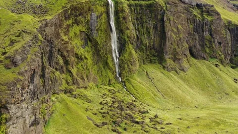 Aerial view of Drífandii, a high, thin waterfall in south Iceland. Stock Footage 154460741