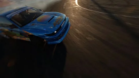 Aerial View Drift Driving a Powerful Sports Car with Smoking Hot Wheels Fpv Shot Stock-Footage 150389828