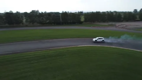 Neon Painted Race Car Drifting Inside Race Track GIF