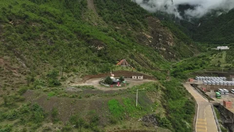Aerial view of drifting clouds between layered green hillside valleys in Video stock 336698766