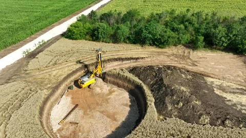 Aerial View of a Drilling Rig Excavating a Wind Turbine Foundation Stock Footage 340317498