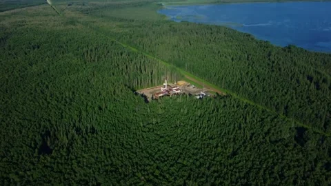 Aerial View of a Drilling Rig in the Forest Near South Wabasca Lake, Alberta Stock Footage 341392251