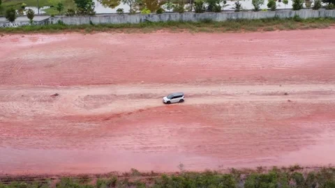 Aerial view of a driver learning to drive in an empty lot Stock Footage 327048683