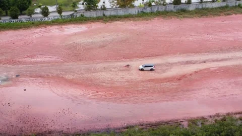 Aerial view of a driver learning to drive in an empty lot Stock Footage 327048846