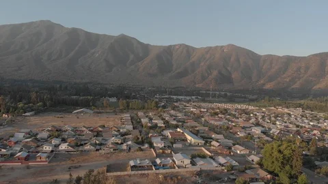 Aerial view dron pan mountain houses fields town 4k Stock Footage 105508034