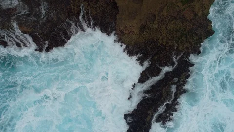 Aerial view by drone 4k camera. Ocean with waves and rocky cliff. Stock Footage 86167675