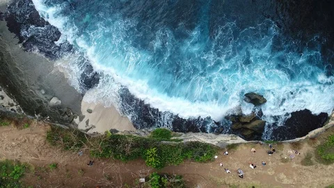 Aerial view by drone 4k camera. Ocean with waves and rocky cliff. Stock Footage 86168073
