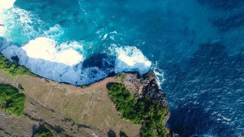 Aerial view by drone 4k camera. Ocean with waves and rocky cliff. Stock Footage 86173256