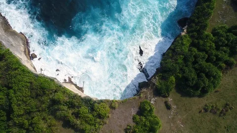 Aerial view by drone 4k camera. Ocean with waves and rocky cliff. Stock Footage 86173274