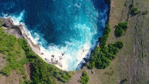Aerial view by drone 4k camera. Ocean with waves and rocky cliff. Video stock 86173472