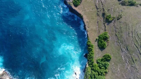 Aerial view by drone 4k camera. Ocean with waves and rocky cliff. Stock Footage 86173822
