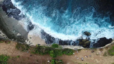 Aerial view by drone 4k camera. Ocean with waves and rocky cliff. Stock Footage 86184192