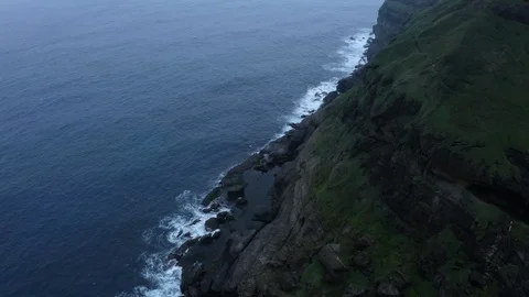 Aerial view by drone 4k camera. Ocean with waves and rocky cliff. Stock Footage 104203956