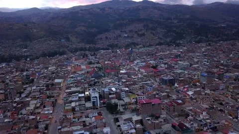 Aerial view from drone approaching the central square of Huaraz over houses at Vídeos de archivo 164580694